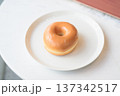 Glazed Donut on White Plate Close-Up 137342517