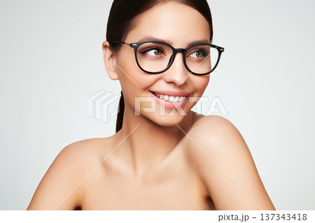 Young woman with eyeglasses on white background 137343418