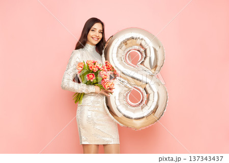 Woman hold bouquet of flowers and balloon number 8 137343437