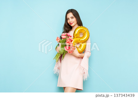 Woman hold bouquet of flowers and balloon number 8 137343439