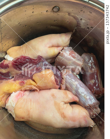 Raw pork meat set for traditional kholodets or aspic cooking. Assorted cuts including pork feet, shank and skin rich in collagen. High quality photo 137343742