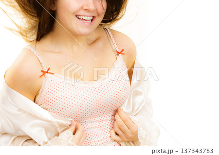 Woman in underwear shirt showing her neckline 137343783