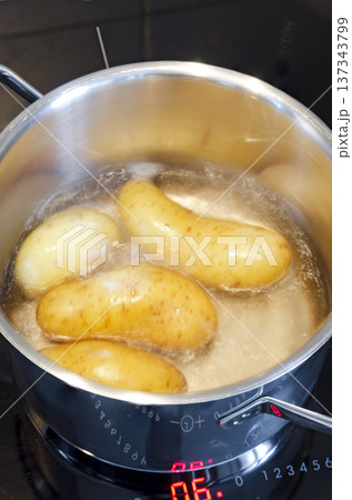 potatoes in boiling water 137343799