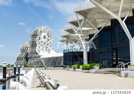 Close-up of Kaohsiung Music Center and the Coral Zone building in Port of Kaohsiung, Taiwan. The white hexagonal building structure on the shore of Love Pier. Close-up of Kaohsiung Music Center and the Coral Zone building in Port of Kaohsiung, Taiwan. The white hexagonal building structure on the shore of Love Pier. 137343929