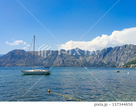 Sailboat anchored in the calm waters of Kotor Bay Sailboat anchored in the calm waters of Kotor Bay 137344650