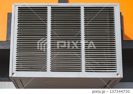 Air conditioner compressor outside building Air conditioner compressor outside building 137344730