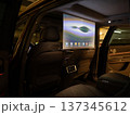 A projector opens in the car's interior for passengers to watch movies. 137345612