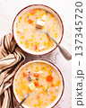 Finnish fish soup, lohikeito soup, creamy fish soup, two bowls of soup, 137345720