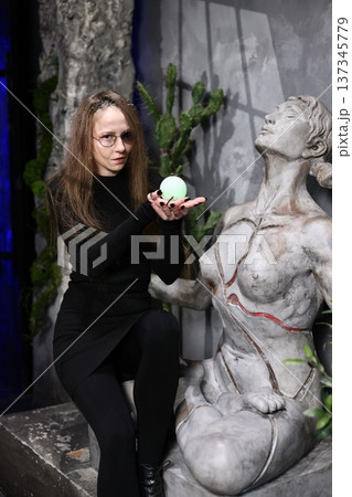 Serene botanical display with weathered stone and verdant accents 137345779