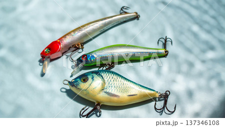 Fishing hobby concept. Accessories on blue background Fishing hobby concept. Accessories on blue background 137346108