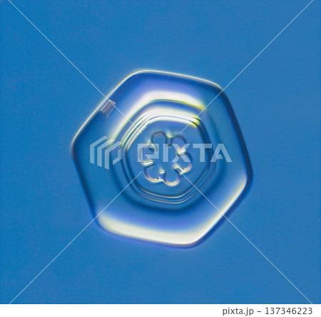 Natural snowflake crystal in blue background Natural snowflake crystal in blue background 137346223
