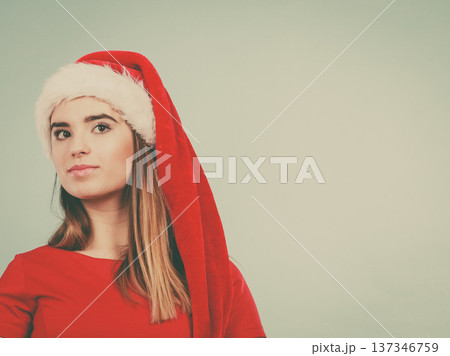 Woman wearing Santa Claus helper costume Woman wearing Santa Claus helper costume 137346759
