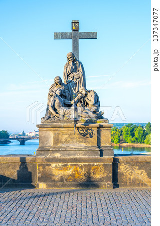 The statue of Piet shows the Lamentation of Christ. It stands on Charles Bridge in Prague, overlooking the river and the city. Visitors often admire the detailed work on the statue. The statue of Piet shows the Lamentation of Christ. It stands on Charles Bridge in Prague, overlooking the river and the city. Visitors often admire the detailed work on the statue. 137347077