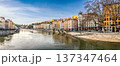 Lyon, France. December 27,2023. Wide format panoramic shot of the city with traditional buildings lining the Saone River, reflecting France's historic architecture under a clear sky. 137347464