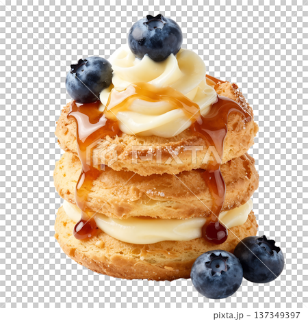 Tempting stack of golden cream puffs profiteroles filled with cream, topped with fresh blueberries and a sweet caramel drizzle, isolated Tempting stack of golden cream puffs profiteroles filled with cream, topped with fresh blueberries and a sweet caramel drizzle, isolated 137349397