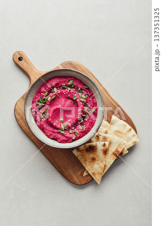 Beetroot hummus decorated with sesame and pumpkin seeds Beetroot hummus decorated with sesame and pumpkin seeds 137351325