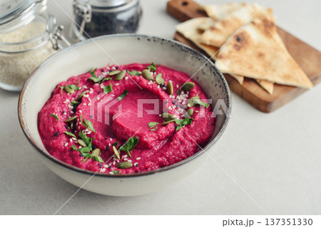 Beetroot hummus decorated with sesame and pumpkin seeds Beetroot hummus decorated with sesame and pumpkin seeds 137351330