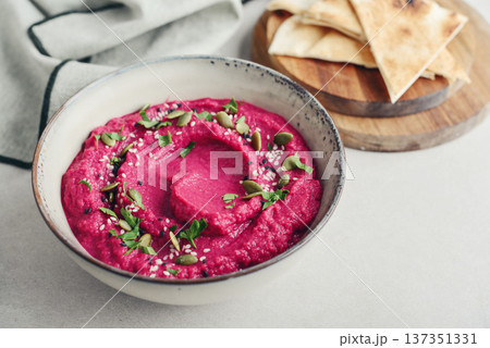 Beetroot hummus decorated with sesame and pumpkin seeds Beetroot hummus decorated with sesame and pumpkin seeds 137351331