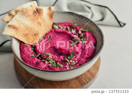 Beetroot hummus decorated with sesame and pumpkin seeds Beetroot hummus decorated with sesame and pumpkin seeds 137351333