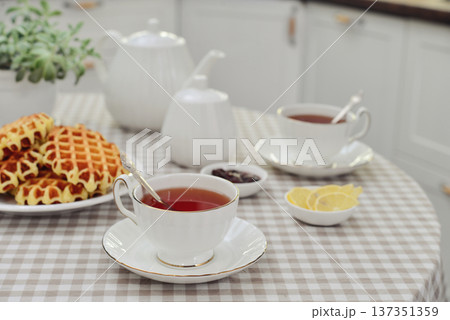 breakfast with tea and a homemade Belgian waffles 137351359