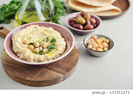 Hummus in a ceramic bowl Hummus in a ceramic bowl 137351371