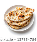 Freshly Baked Flatbreads on a White Plate with Charred Spots and Soft Texture 137354784