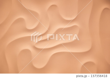 Abstract peach background with soft wavy pattern and creamy undulating texture Abstract peach background with soft wavy pattern and creamy undulating texture 137356418