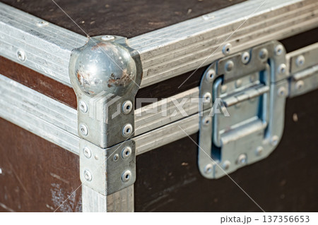 Durable road case protecting equipment with metal corners, latches, and rivets 137356653