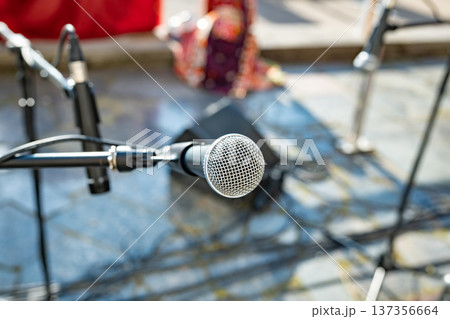 Microphone on stage preparing for an outdoor performance, sound equipment ready 137356664