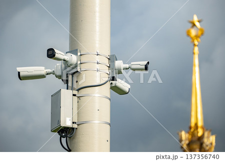 CCTV cameras monitoring an urban area with Kremlin star pinnacle in the background 137356740