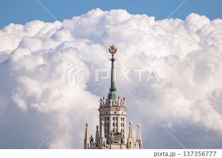 Moscow skyscraper spire with soviet star against a dramatic cloudy sky Moscow skyscraper spire with soviet star against a dramatic cloudy sky 137356777
