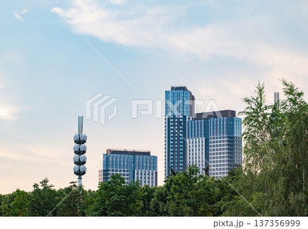 Modern city skyline from park with skyscrapers and communication tower 137356999