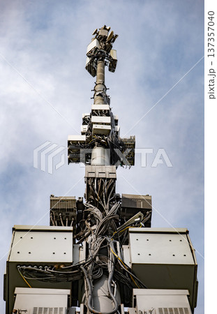 5G cell tower transmitting wireless signal, telecommunication network infrastructure 5G cell tower transmitting wireless signal, telecommunication network infrastructure 137357040