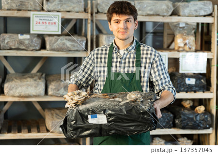 Store employee holding mycelium 137357045