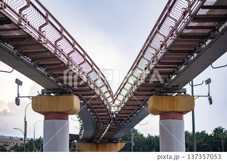 Monorail track splitting creating a junction, representing choice and divergent paths Monorail track splitting creating a junction, representing choice and divergent paths 137357053