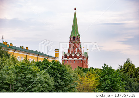 Kremlin's Troitskaya Tower with red star rising above lush green trees in Moscow Kremlin's Troitskaya Tower with red star rising above lush green trees in Moscow 137357319