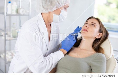 Facial injection young patient 137357694