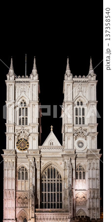 Westminster Abbey, London. The Gothic architecture is beautifully illuminated under the evening sky, showcasing the detailed facade and majestic towers. Westminster Abbey, London. The Gothic architecture is beautifully illuminated under the evening sky, showcasing the detailed facade and majestic towers. 137358540