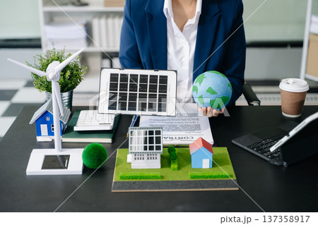 Business people planning hand using laptop for working technology and business Net zero and carbon neutral 137358917