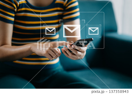 Woman hands using Laptop, tablet typing on keyboard and surfing the internet with email icon, email marketing concept, send e-mail or newsletter, online working internet network technology. 137358943