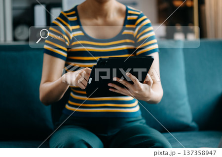 Searching Browsing Internet Data Information Networking Concept with blank search bar. woman working with mobile phone and laptop computer VR icon 137358947