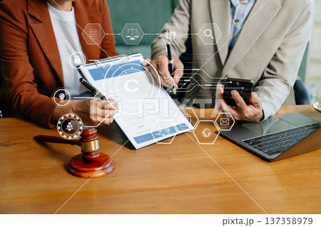 Copyright or patent concept, Business team analyzing data and using smart phone and tablet with virtual screen 137358979