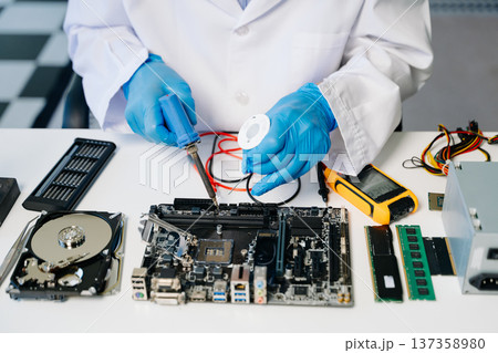The technician repairing the motherboard in the lab with copy space. the concept The technician repairing the motherboard in the lab with copy space. the concept 137358980
