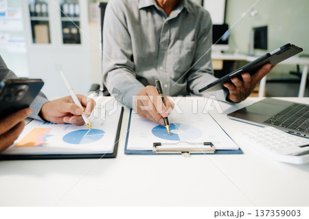 Business documents on office table with smart phone and calculator digital tablet and graph business Business documents on office table with smart phone and calculator digital tablet and graph business 137359003