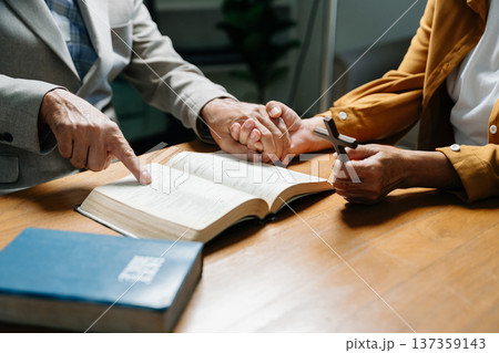 Christians are congregants join hands to pray and seek the blessings 137359143