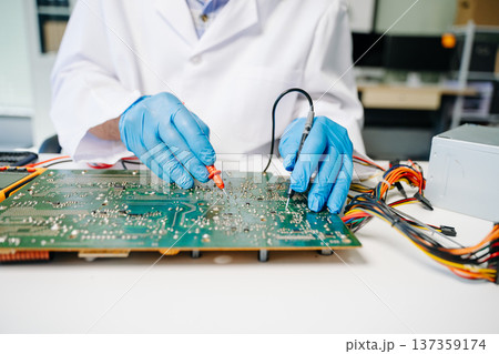 The technician repairing the motherboard in the lab with copy space. the concept The technician repairing the motherboard in the lab with copy space. the concept 137359174
