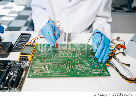 The technician repairing the motherboard in the lab with copy space. the concept The technician repairing the motherboard in the lab with copy space. the concept 137359175