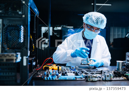 Professional electronics technician repairing computer motherboard in modern lab. Hardware engineering, cybersecurity, data technology, server maintenance Professional electronics technician repairing computer motherboard in modern lab. Hardware engineering, cybersecurity, data technology, server maintenance 137359473