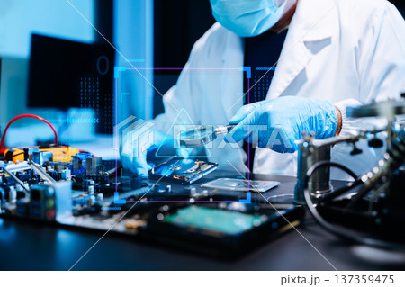 Professional technician repairing hard drive for data recovery in modern technology lab. Digital storage, cybersecurity, hardware repair and data protection concept. Professional technician repairing hard drive for data recovery in modern technology lab. Digital storage, cybersecurity, hardware repair and data protection concept. 137359475