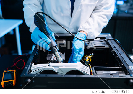 Technician installing graphics card inside desktop PC. Computer hardware upgrade, motherboard wiring, IT repair service and technology 137359510